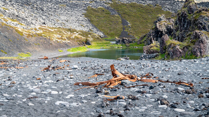 Rusty remains of a shipwreck lie scattered on Djupalonssandur beach, Snaefellsjokull National Park, Iceland.