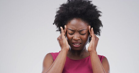 Headache, pain and black woman in studio, stress and frustrated on white background. African...