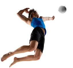 Professional volleyball player jumps for spike with intense focus wearing blue shirt isolated on...