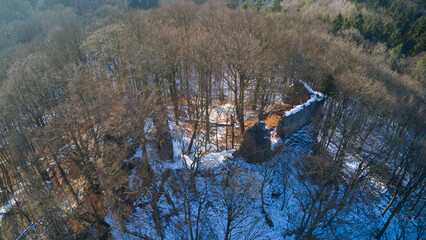 The ruins of Bradlec Castle and the snowy Czech landscape
