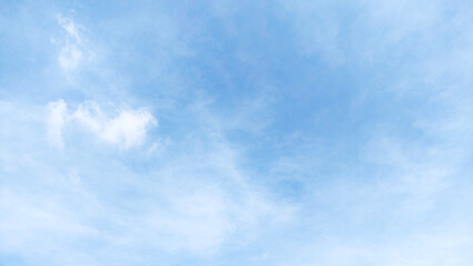 The blue sky has a background of white clouds covering a wide horizontal area.