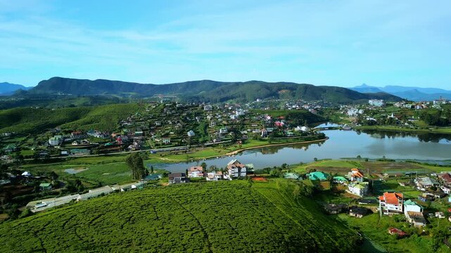 Drone Pan Of Nuwara Eliya Town, Tea Fields And Lake Gregory In Bright Weather