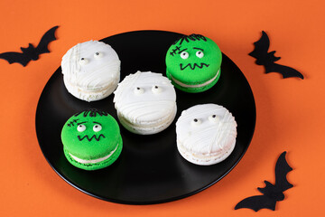 Cake macarons in shape of Frankensteins and haunted for a Halloween party