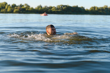 Man drowning in a lake during summer vacation