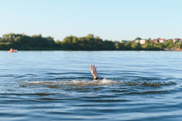 Drowning man reaching for help in river