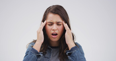 Pain, tension and woman with headache in studio from stress, vertigo and overwhelmed by ache....