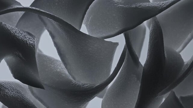 Close-up View of Orange and Gray Paper Strips, a Macro Shot in a Video Sequence