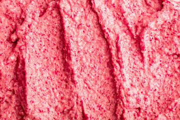 Fruit pink ice cream. Yogurt smoothie with fresh fruits and berries. Ice cream texture. Delicious sweet dessert close-up as background.