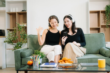 Explore vibrant teamwork, creativity, and learning with young adults using laptops and headphones...