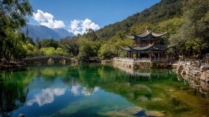 Fototapeta premium Tranquil scenic view featuring a traditional Chinese pavilion beside a lake near a stone bridge.