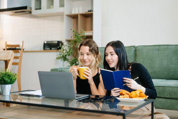 Explore vibrant teamwork, creativity, and learning with young adults using laptops and headphones...