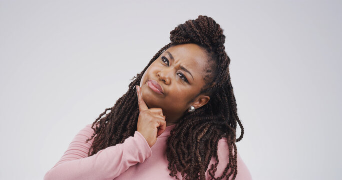 African woman, thinking and choice in studio for problem solving, solution and doubt question. Space, female person and guess reaction for ideas, planning and unsure with decision on white background