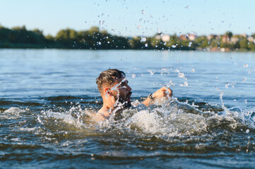 Man drowning in a lake during summer vacation