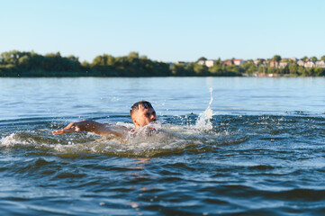 Man drowning in river during summer day