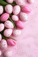 Elegant arrangement of pink tulips and speckled Easter eggs on a pastel pink background for spring celebrations