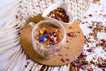 Herbal tea with natural ingredients. Transparent glass with brewed natural herbal tea from fruits...