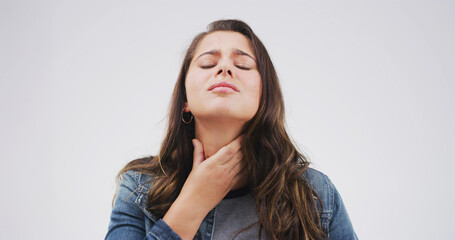 Allergy, hurt and woman with sore throat on studio space for cold, flu or virus symptoms. Asthma, bacteria or female person isolated on white background with neck pain, thyroid inflammation or injury