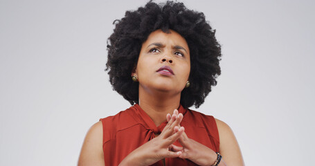 Thinking, confused and black woman in studio, decision and contemplation on white background. African person, hands together or problem solving with doubt, choice or wonder with solution or uncertain