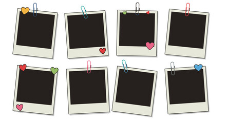 Blank photo frames with heart and paperclip accents on white background