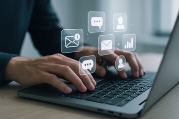 Digital Connectivity: A close-up shot captures hands skillfully navigating the keys of a modern laptop, as ethereal digital icons representing communication and information hover above.