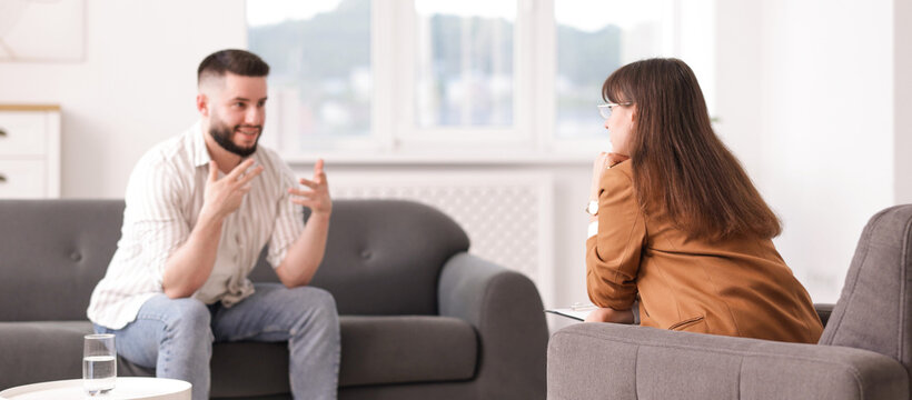 Professional psychologist working with patient in office, selective focus