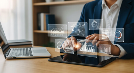 A businessman is analyzing data on a virtual dashboard