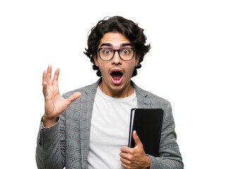 A young man with glasses holds a book and expresses shock with his hand raised and mouth open, isolated on white isolated on transparent background