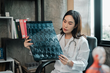A focused doctor examines an X-ray in a contemporary medical office, highlighting professional...