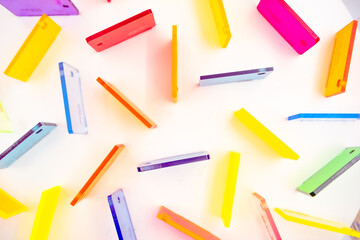 multicolored pieces of acrylic sheets cast on a white background