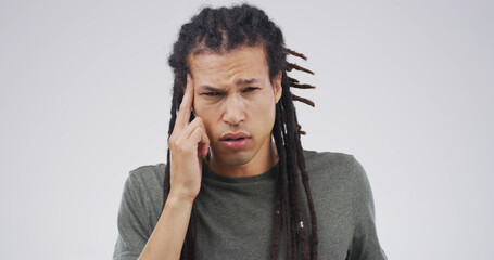 Portrait, hurt or man with headache in studio with stress, burnout space or artist. Frustrated,...