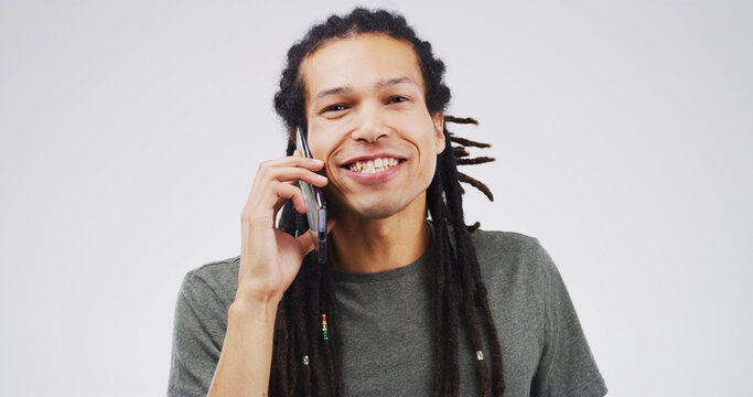 Designer, phone call or happy man in studio portrait with contact, chat or conversation. Feedback, deal and creative person on mobile discussion with smile, client or mockup space on white background - Powered by Adobe