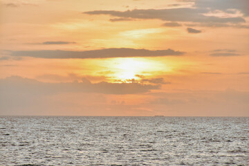 Fototapeta premium Sunset sky clouds in the Evening with Golden orange sunlight in golden hour, Dusk sky background 