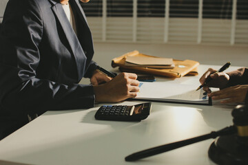 Lawyer explained to the client about the law that must be brought against the court case.