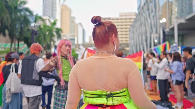Asian LGBTQ people proudly marching in pride parade during Pride Month