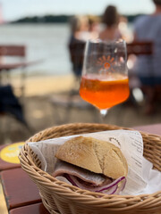 Traditional north german street food snack Fischbroetchen wheat bun with matjes fish fillet and...