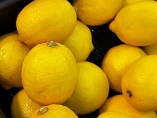 fresh yellow lemon selling on market store 