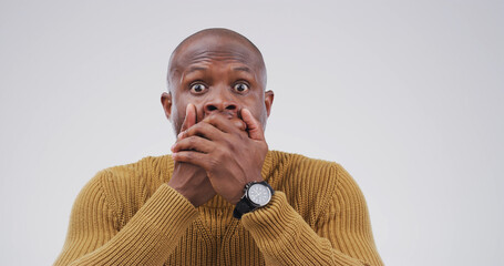 Surprise, rumor and portrait of black man in studio with omg, wow and wtf face expression. Shocked,...
