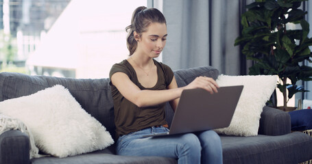 Laptop, relax and woman on sofa in home with remote work for creative project online in living...