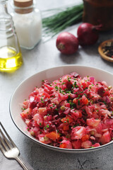 A bowl with Vinegret salad, a typical Russian dish