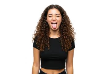 A young woman with curly hair playfully sticks her tongue out with her eyes closed, isolated on transparent background