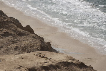 Coastal Landscape with "LOVE" Written with Stones