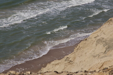 Overlooking the Ocean and Beach from a Cliff Edge