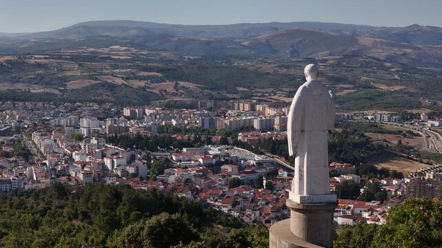 Aerial view of Saint Bartolomeu statue overlooking Braganca, Portugal