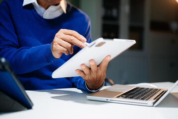 man Account Manager Working at Table with New Business Project. Typing keyboard,Using Contemporary...