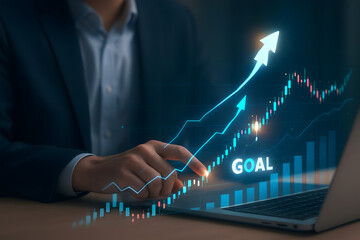 Businessman analyzing stock market data and growth charts to achieve goals