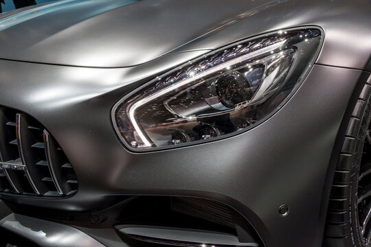 Close-up of the headlight on a Mercedes-AMG C43 4MATIC Coupe high-performance luxury sports car. (2017)