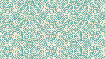 Repeating pattern of turquoise floral designs on a light background in a symmetrical arrangement
