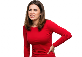 A young woman in a red shirt grimaces in pain, holding her lower back, isolated on a transparent background