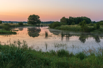 orange misty sunrise over the river