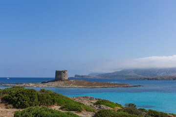 Caletta della Torre beautiful view of ruined tower on la pelosa beach sardinia italy